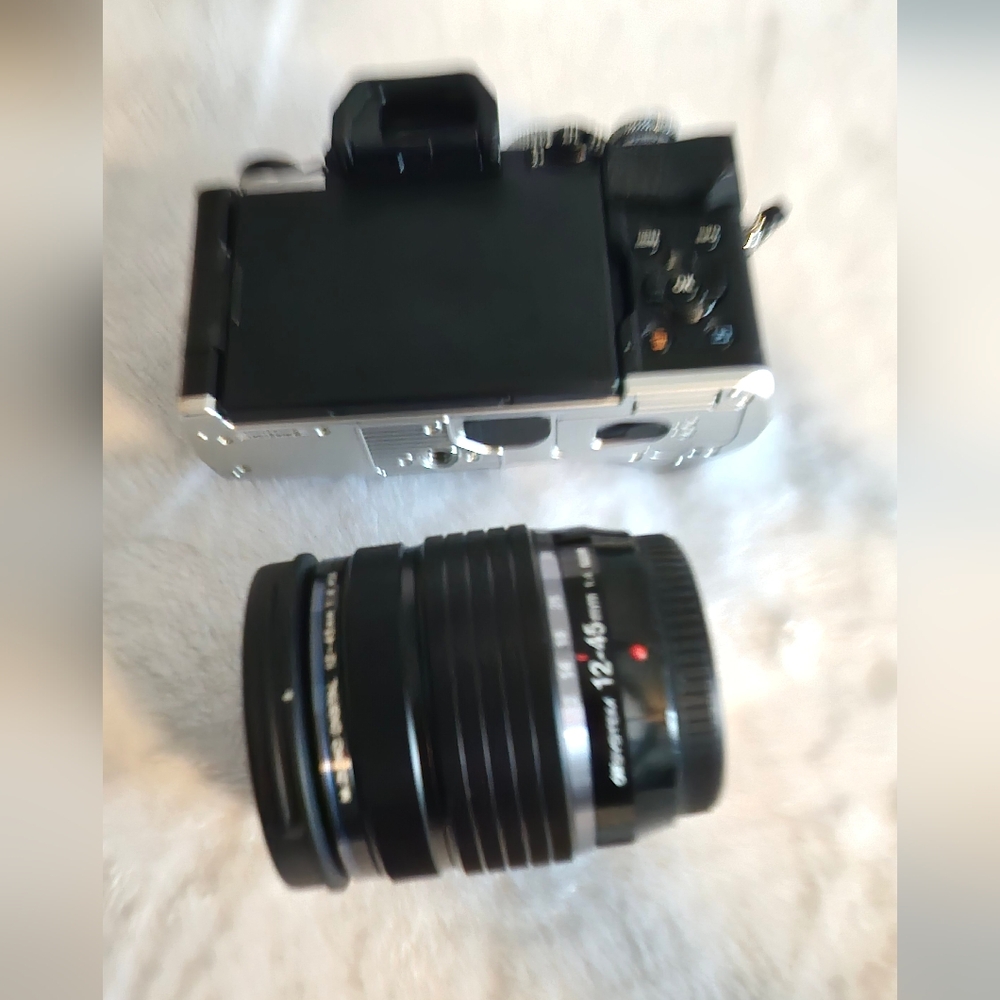 OM SYSTEM OM-5 Silver and Black Digital Camera and 12-45mm pro lens